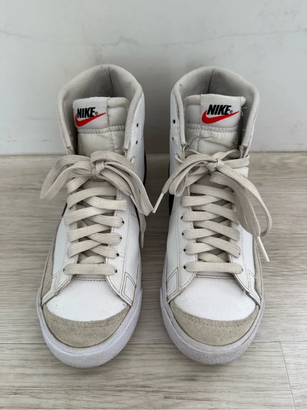 Nike Blazer Mid '77 White High-Top Sneakers with Black Swoosh